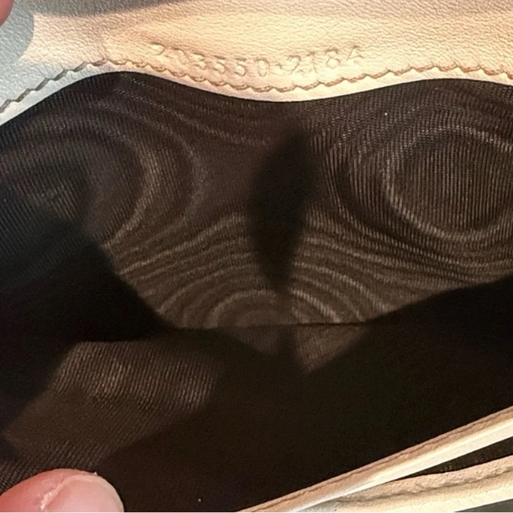 Gucci GG Canvas Long Wallet featuring white leather and heart-shaped closure